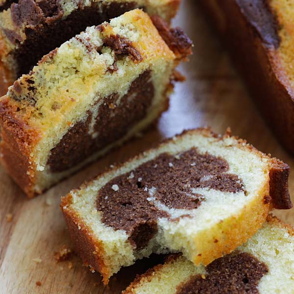 Premium Photo | Slice of marble travel cake, square cake with melted  chocolate on the center. served on rustic plate