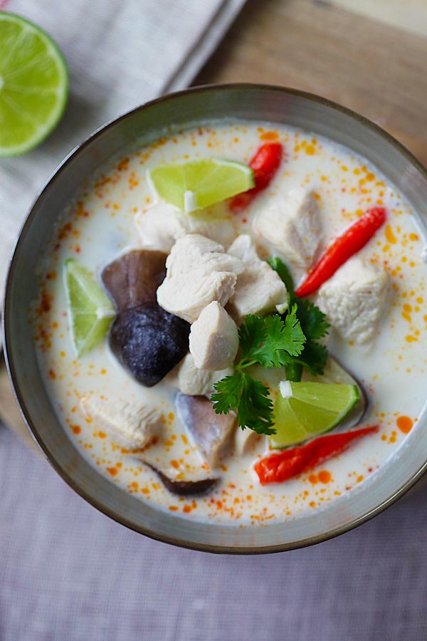 Easy recipe for Thai tom kha gai made with chicken, mushroom and coconut milk in a bowl.