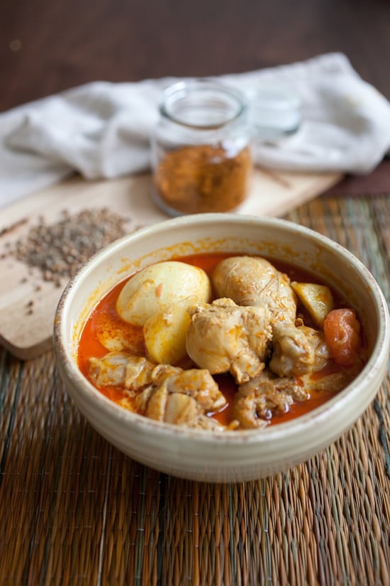 Easy curry chicken legs in serving bowl made using a Malaysian curry chicken recipe.