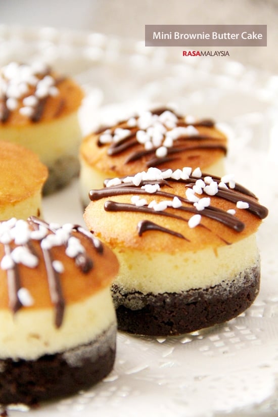 Easy and delicious homemade mini brownie butter chocolate cake topped with chocolate sauce and sprinkles.