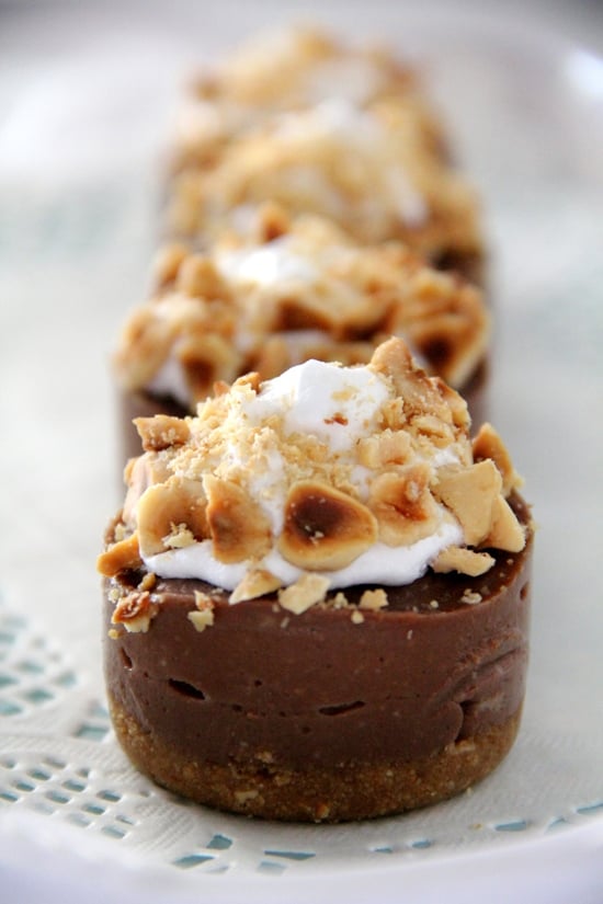 Easy and delicious homemade no-bake Nutella cheesecake made with creamy cream cheese and Nutella, topped with whipped cream and toasted hazelnuts.