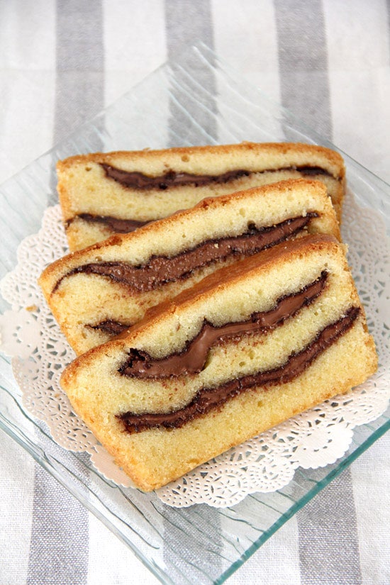 Three pieces of Nutella swirled pound cake on a plate, ready to serve.