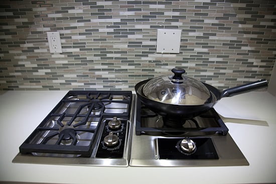 A seasoned wok on the stove top in a Chinese wok kitchen.