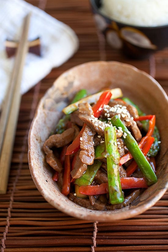 Homemade asparagus beef in a bowl ready to serve.