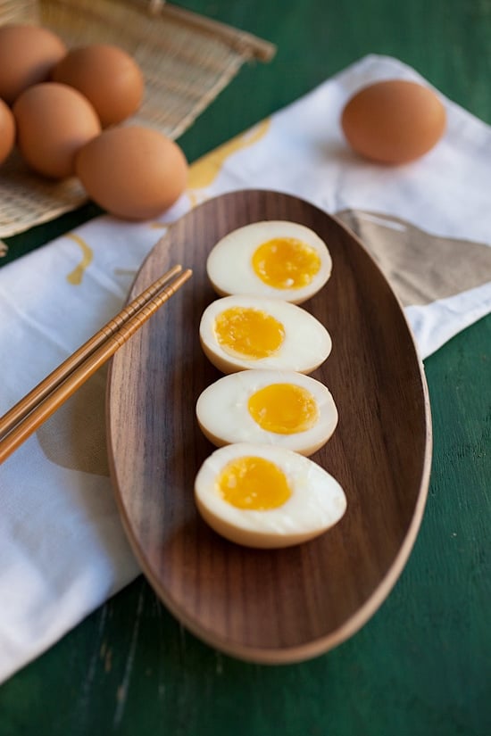 Ramen flavored Eggs with runny interior served on a plate and ready to be eaten.