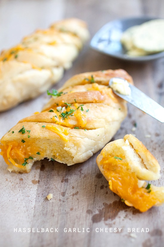 Sliced and buttered Hasselback garlic cheesy bread, ready to serve.