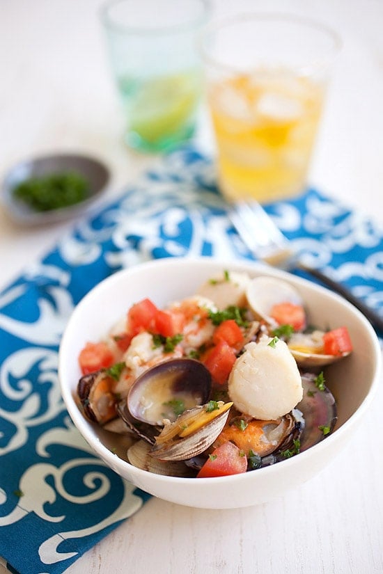 Seafood stew with shrimp, scallops, mussels and clams in a bowl.