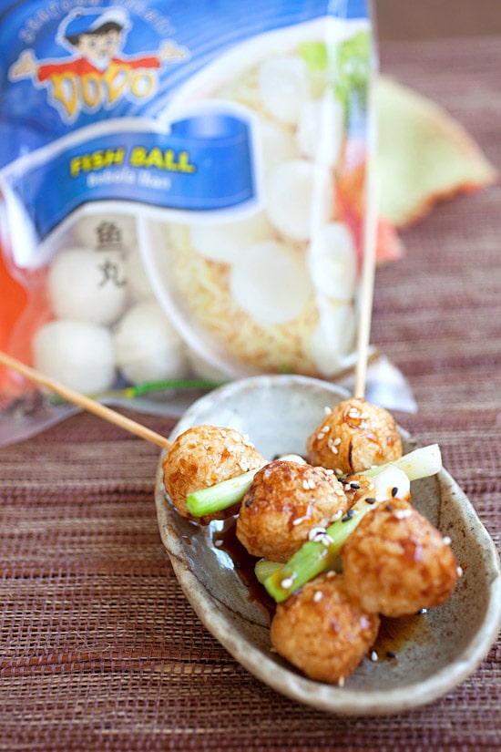 Fish ball skewers with glazed teriyaki sauce in a serving dish.