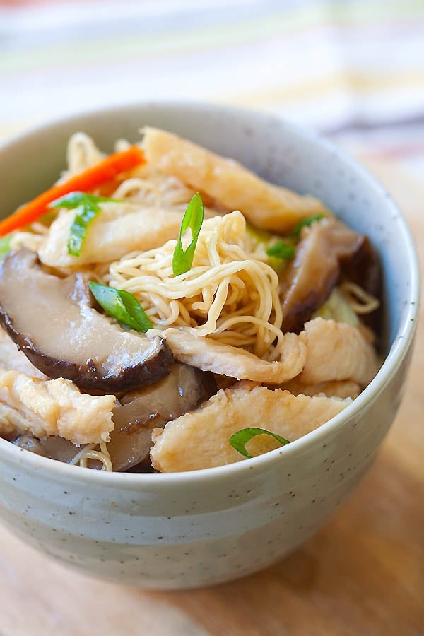 Healthy Chinese Chicken Lo Mein with carrots, green onions, and mushrooms in a bowl ready to serve.