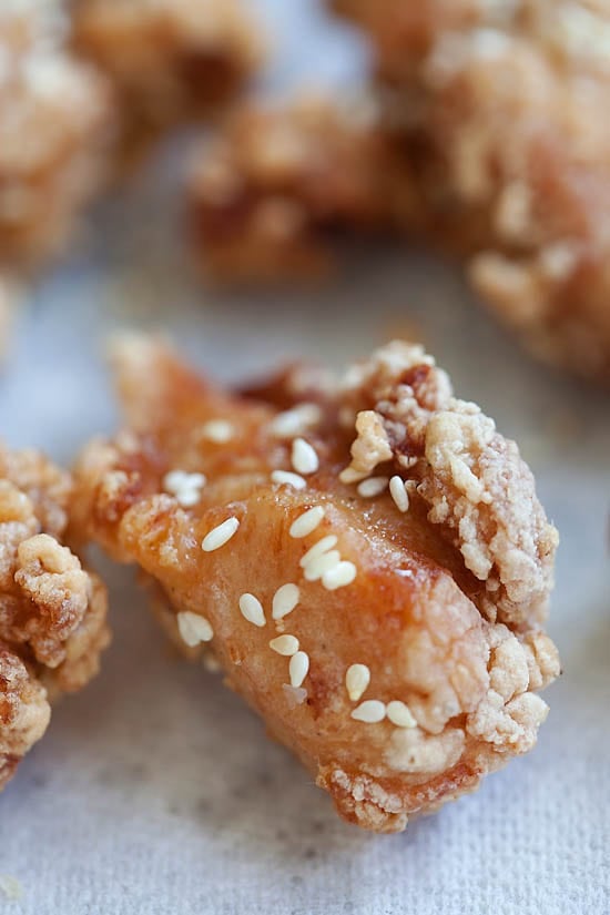 Close up of Crispy and Crunchy Japanese fried chicken garnished with sesame seeds.