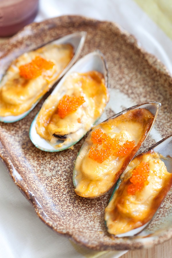 Baked mussels dynamite with cheese, mayo, mussels ready to serve.