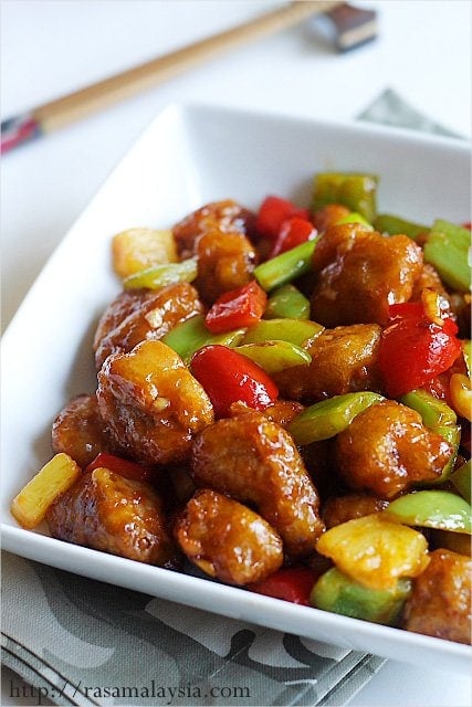 Serving bowl of authentic sweet and sour pork made with homemade sweet and sour sauce.