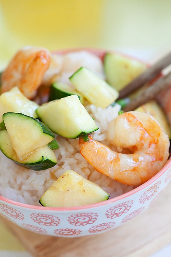 Delicious Asian stir-fry with shrimps and zucchini on top of rice.