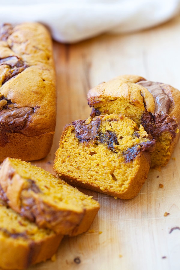 Easy and healthy homemade Nutella Swirled Pumpkin Bread loaf sliced in pieces.