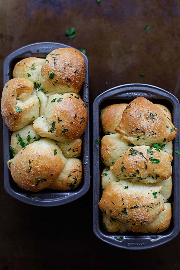 Tasty pull apart garlic bread in baking trays.