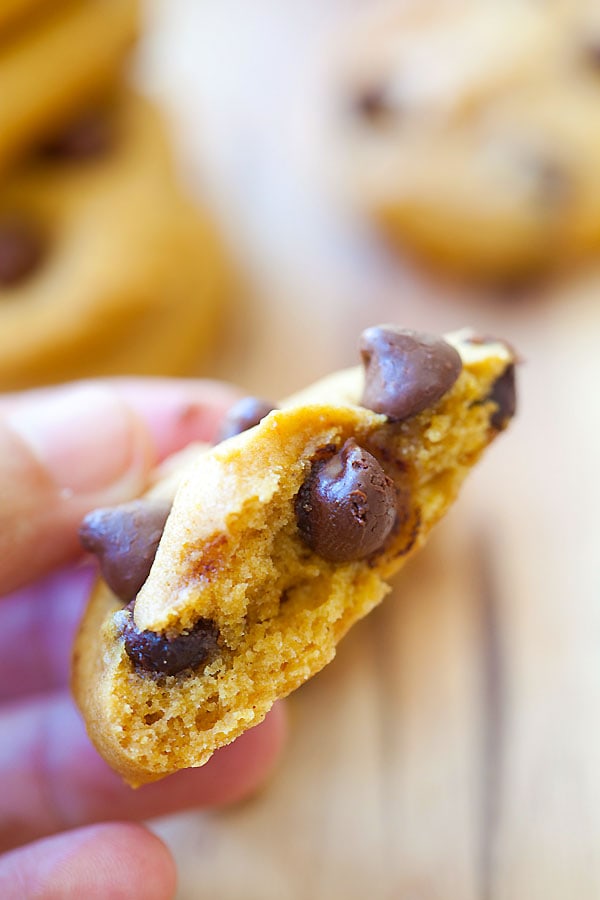 Homemade pumpkin chocolate chip cookies in half.