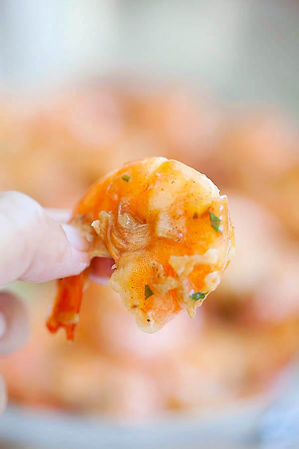 Hawaiian Shrimp Scampi pick with fingers.