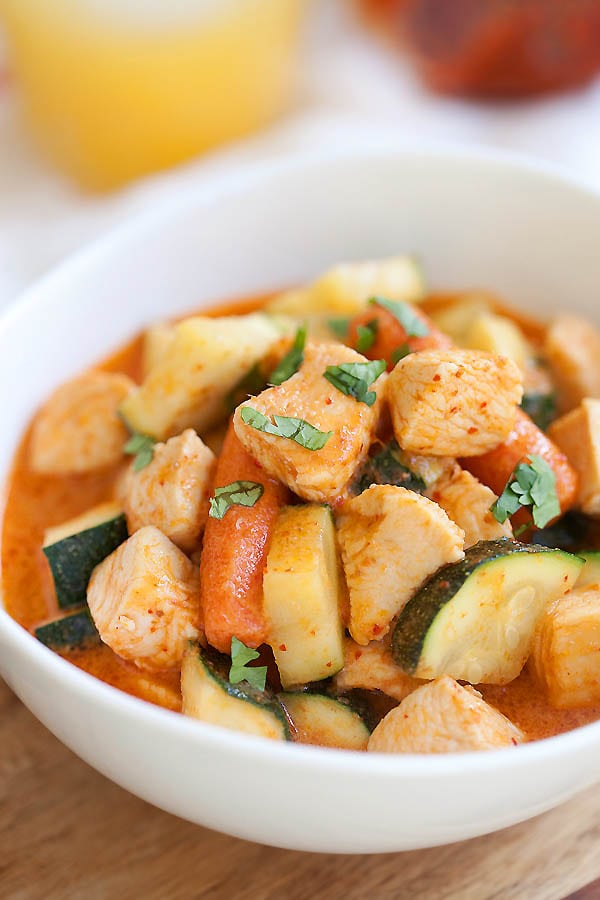 Zucchini and chicken Thai red curry in a bowl.