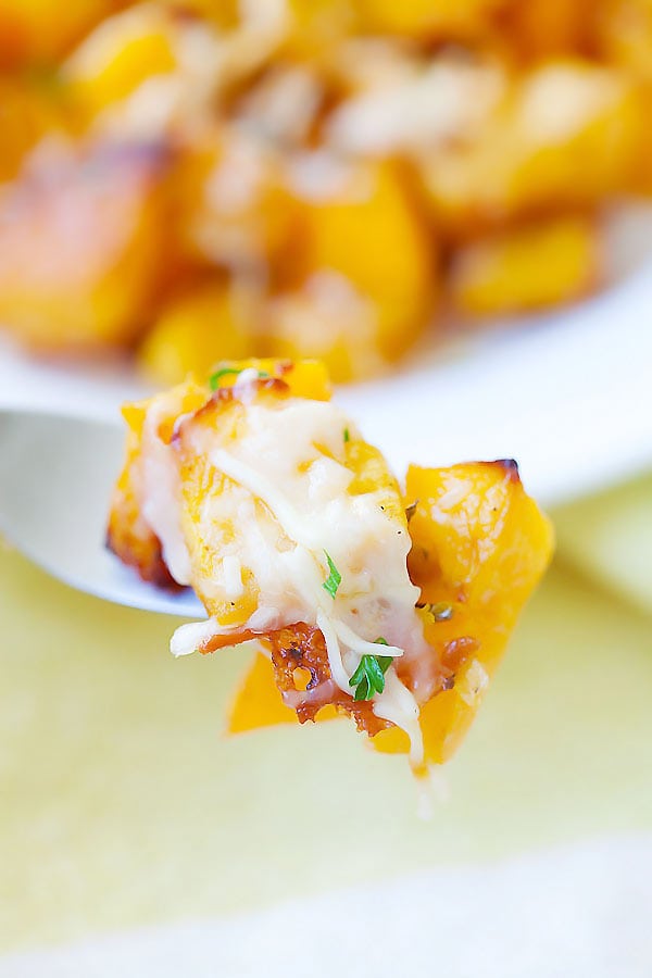 Forkful of sweet tender butternut squash roasted with butter, garlic and Parmesan cheese.