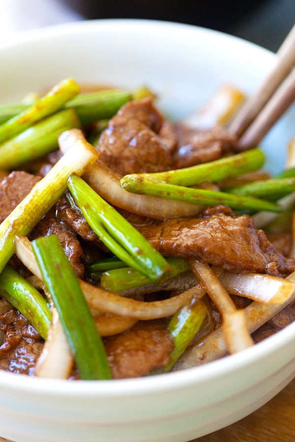 Asian stir fry Onion scallion beef in homemade easy brown sauce.