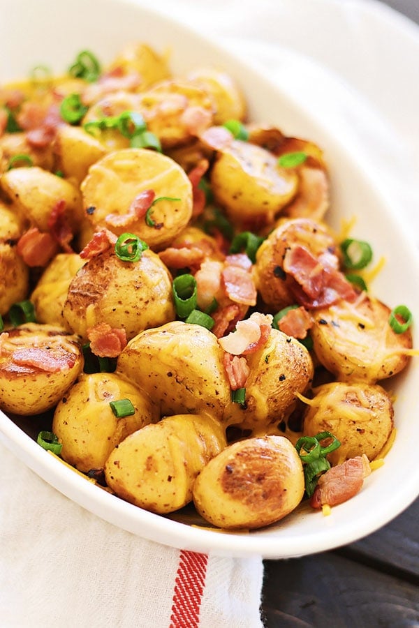 Cheesy Roasted Potatoes with Bacon in a serving dish.