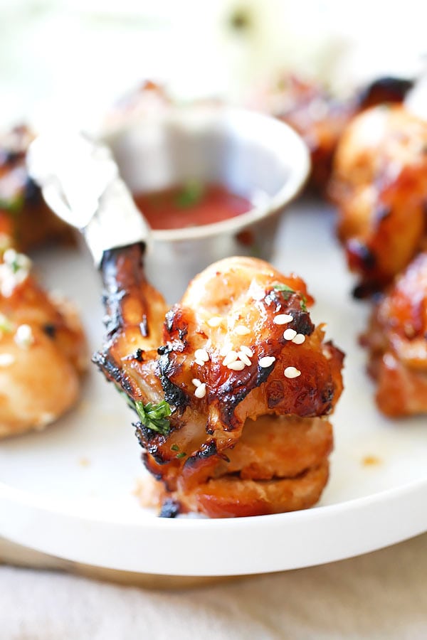 Baked Chicken Lollipop marinated with hoisin ginger in a serving dish.