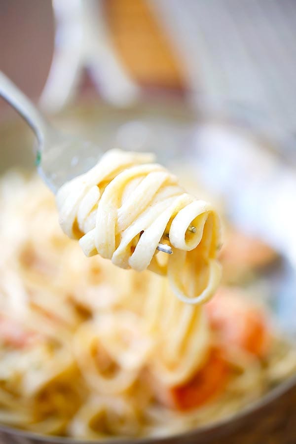 Creamy and rich homemade shrimp pasta rolled on a fork.