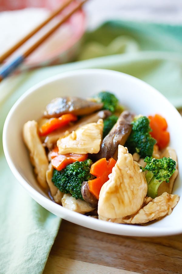 Hoisin chicken with hoisin sauce, mixed with vegetables in a bowl.