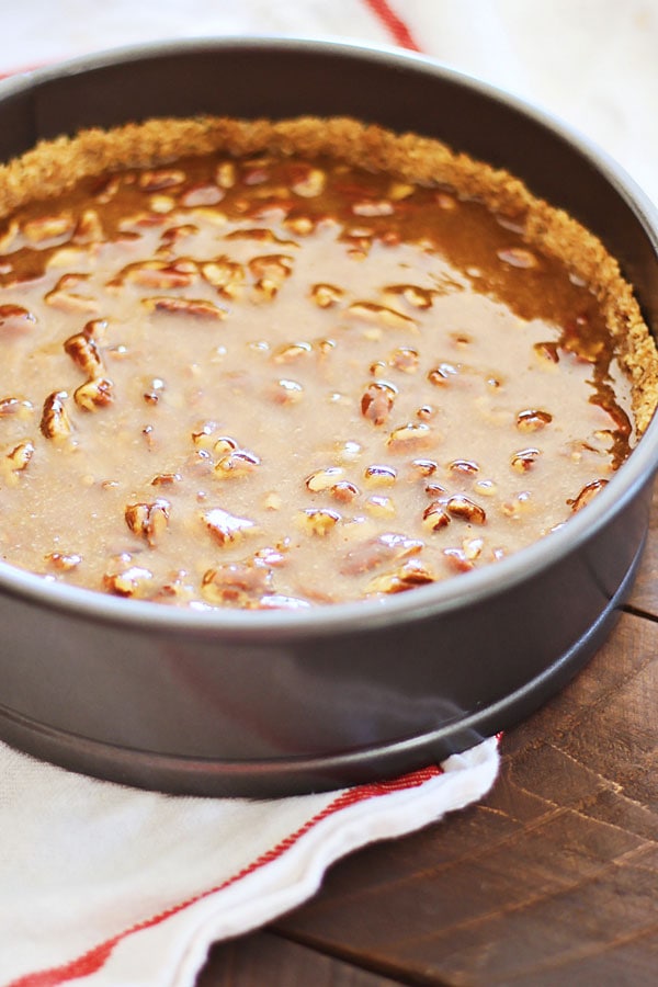 Pecan Pie Cheesecake pre-baked in a cake pan.