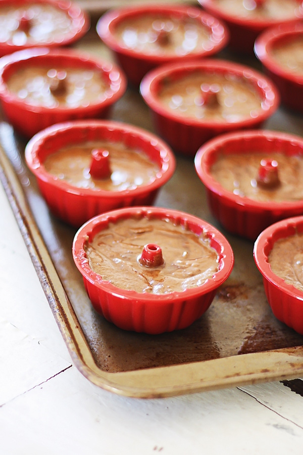 'Chocolate bundt cake in mini bundt cake tins pre-baked.