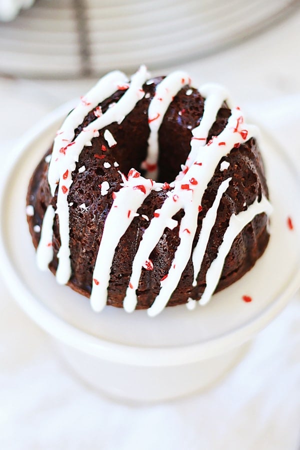 'Festive mini chocolate bundt cake with peppermint frosting, ready to serve.