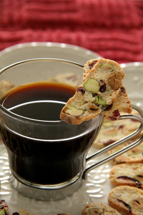 Cranberry and Pistachio Biscotti with a cup of coffee, ready to serve.