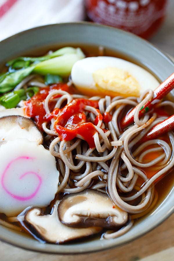 Spicy Japanese Soba Noodle with homemade sriracha broth in a bowl ready to serve.