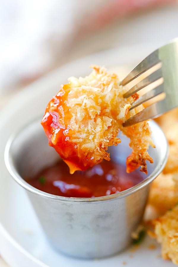 Crispy Parmesan Baked Popcorn Shrimp dipped in homemade red dipping sauce.