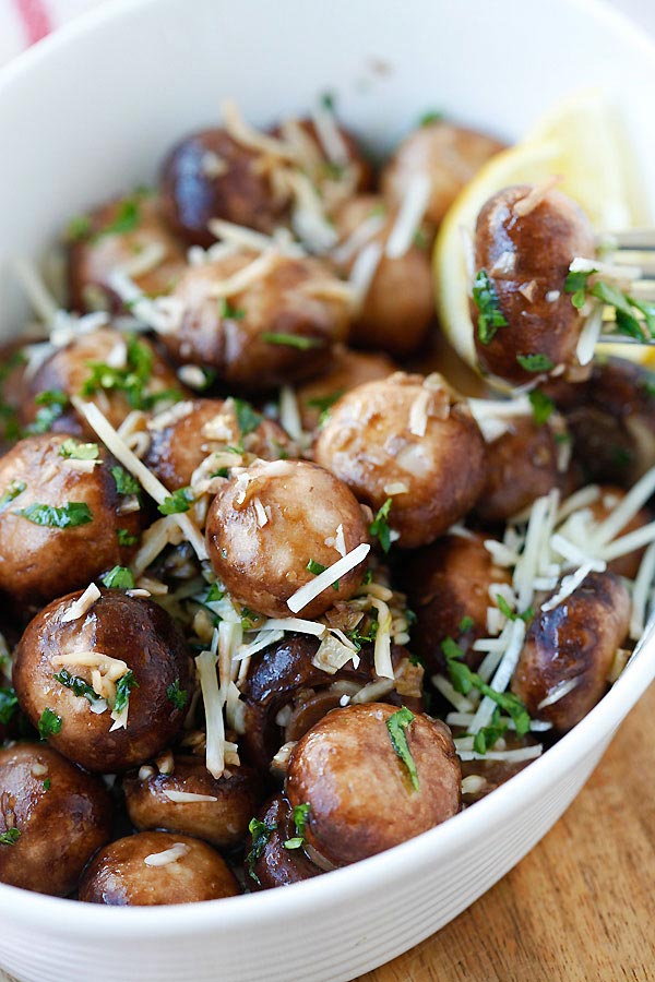 Garlic Herb Sauteed Mushrooms with a fork picking some mushrooms.