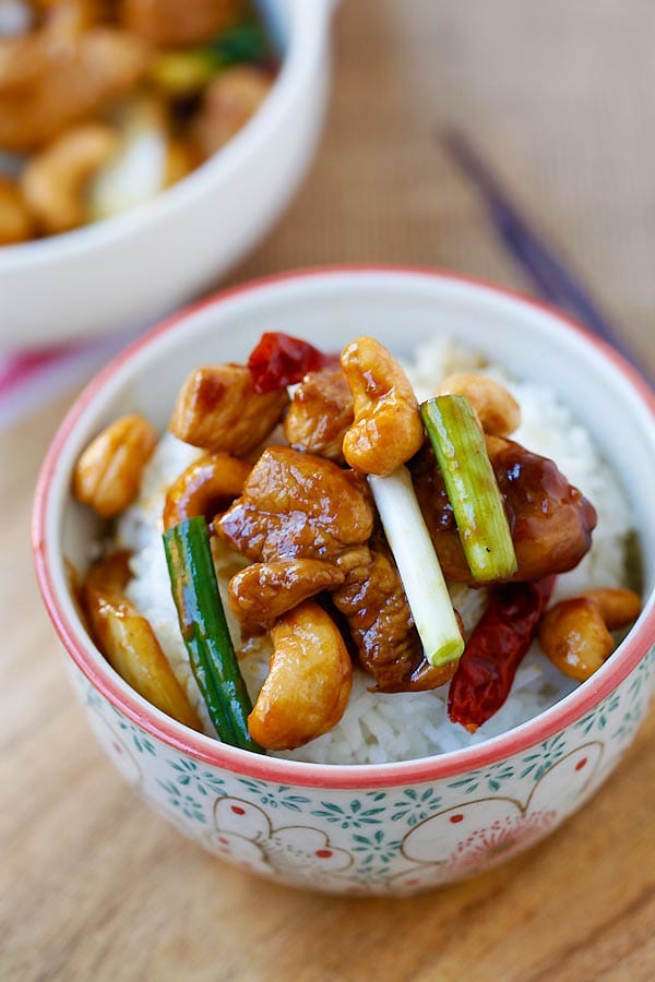 Asian stir fry Spicy Cashew nuts with Chicken on top of rice.