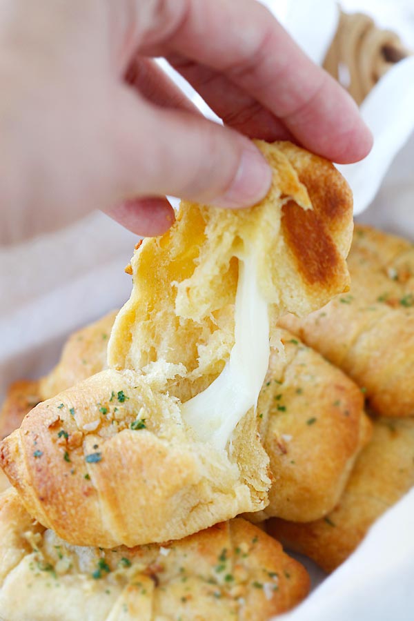Amazing homemade crescent rolls loaded with stringy Mozzarella cheese in half.