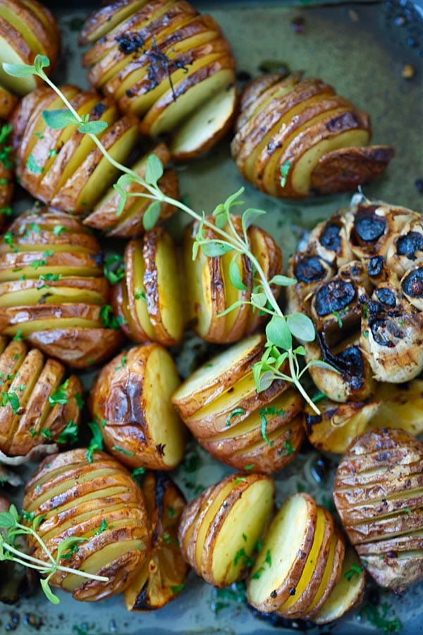 Healthy and easy baked Garlic Herb Roasted Potatoes in baking tray.