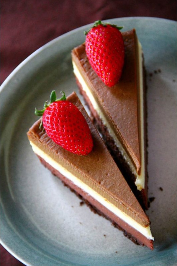Easy and delicious Triple Layer Cheesecake made with dark chocolate, white chocolate and Kahlua coffee flavor.
