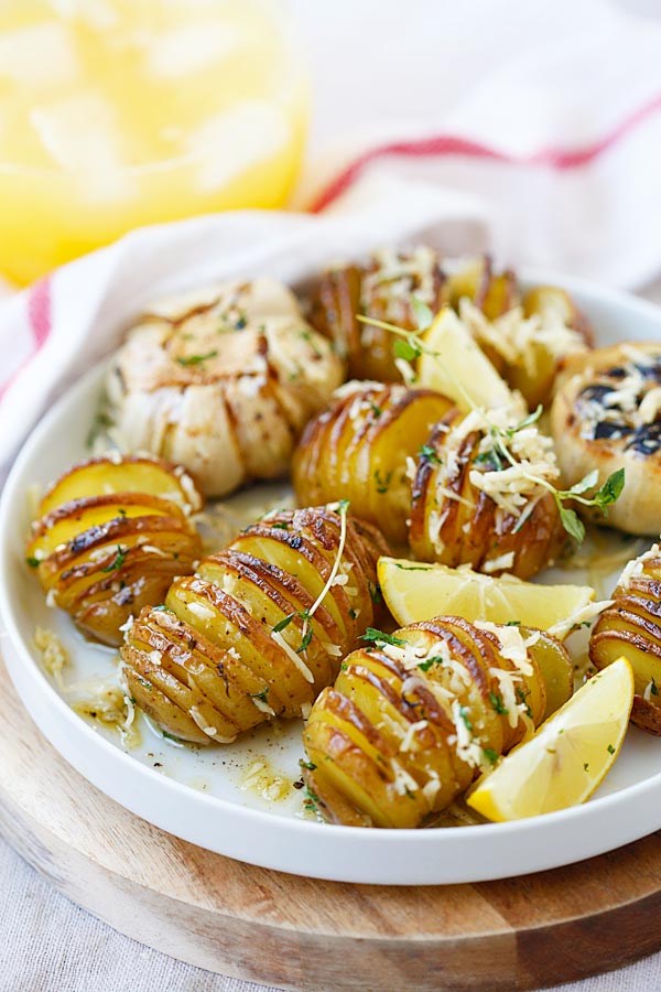 Homemade healthy roasted potatoes with Parmesan cheese, butter and herbs.
