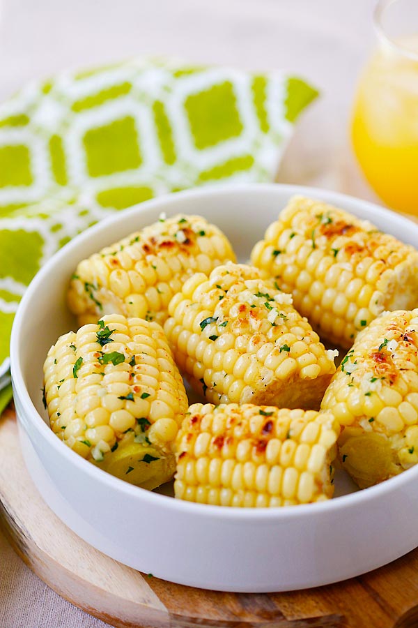 Easy and quick Grilled Garlic-Herb Butter Roasted Corn in a bowl.