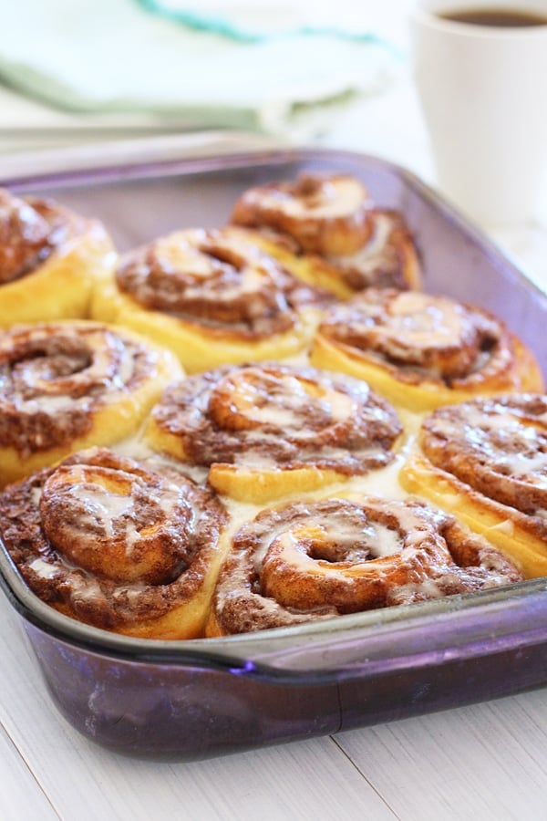 Easy and delicious homemade pizza dough cinnamon rolls in baking tray, ready to be served.