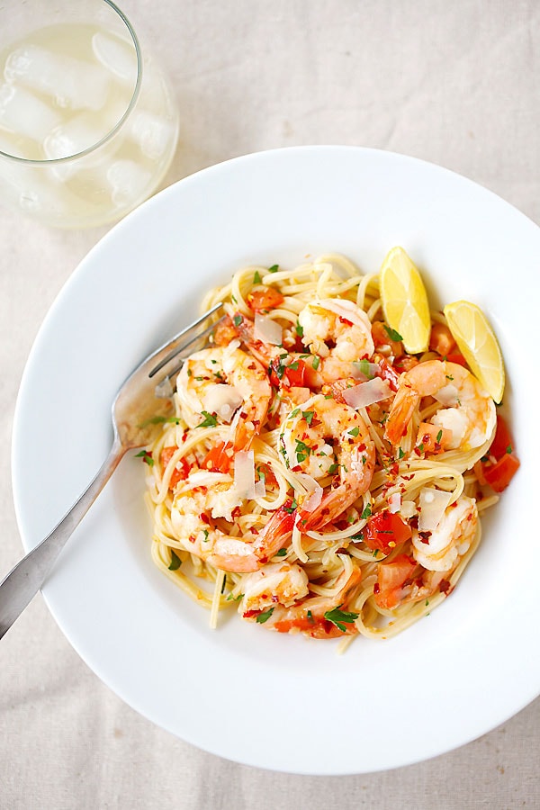 Shrimp pasta with chili flakes and garlic herb sauce in a plate.