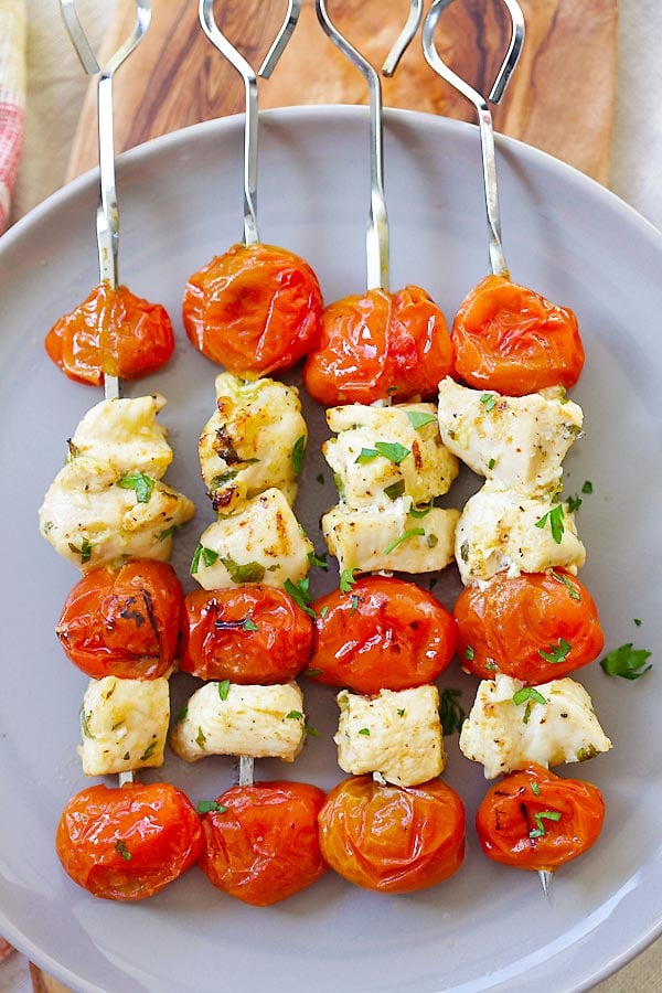 Greek Chicken Kebab in metal skewers in a plate ready to serve.