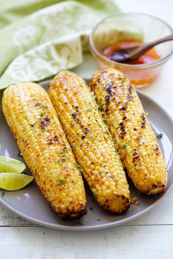Easy and quick honey sriracha butter grilled corn on the cob.