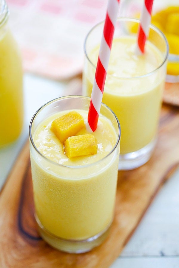 Mango Lassi - a rich, popular Indian smoothie with fresh mango, yogurt and honey. Easy recipe that takes 10 mins to make! | rasamalaysia.com