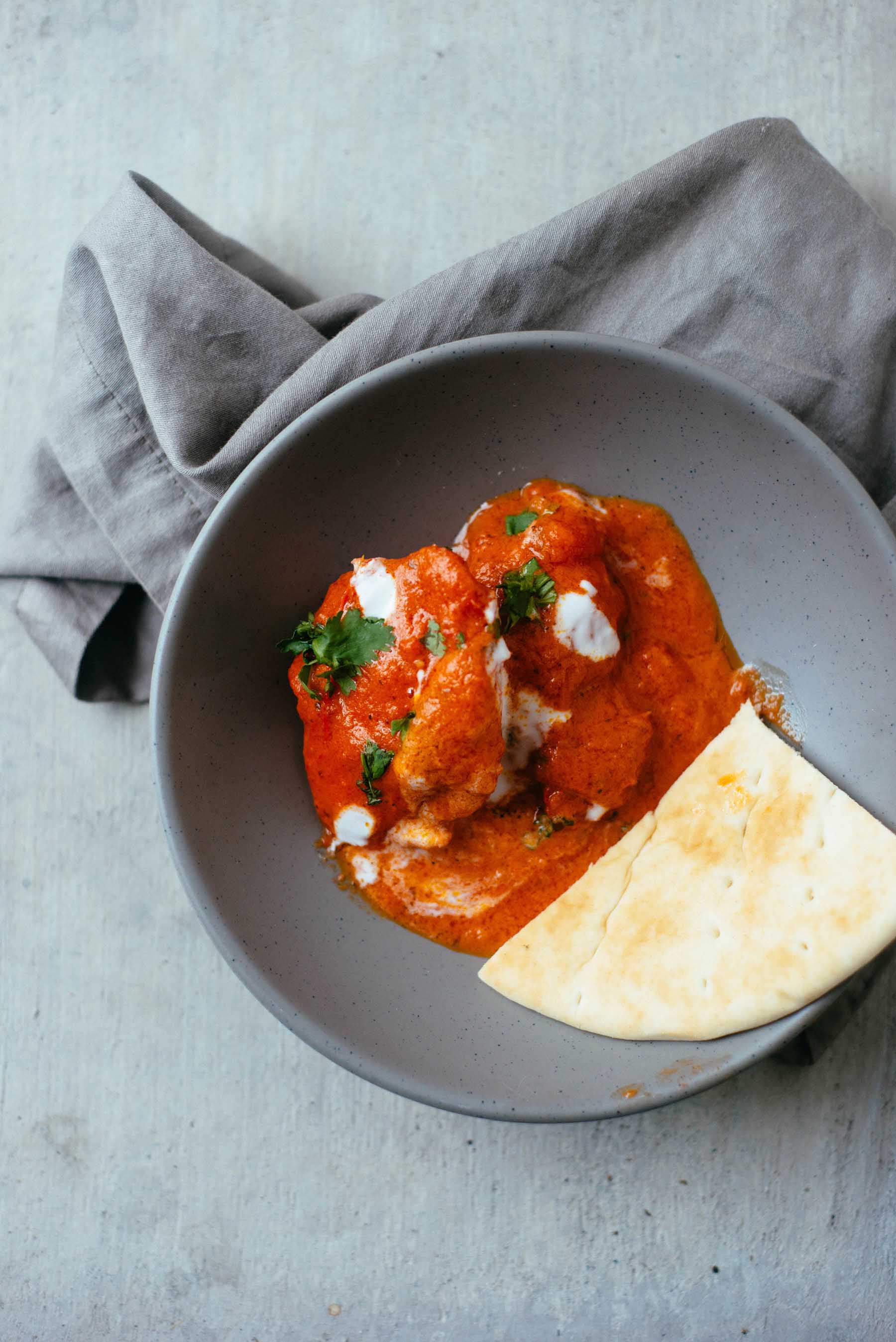 Serve the butter chicken with naan or Indian flat bread.