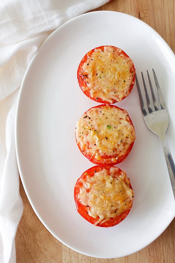 Easy and quick healthy Parmesan Roasted Tomatoes in a plate ready to serve.