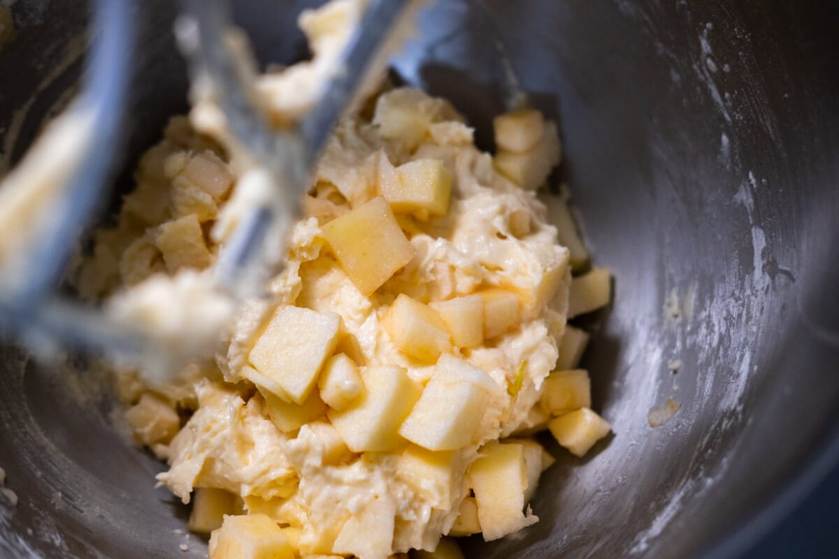 Mix the apple cubes to the batter using a stand mixer.