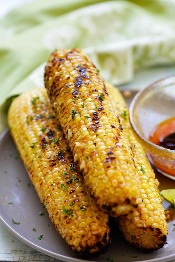 Oven roasted basil butter corn in a plate.